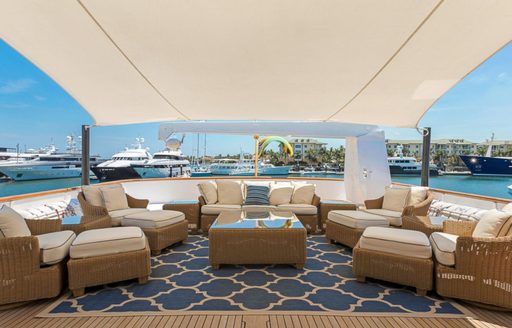 chic alfresco lounge with shade on board motor yacht PRAXIS 