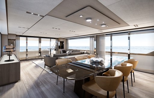 Elegant dining table and chairs in salon on Ferretti superyacht EPIC