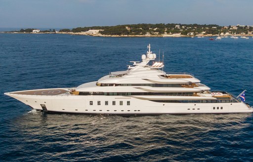 Charter yacht CC-SUMMER at anchor with an island in the background