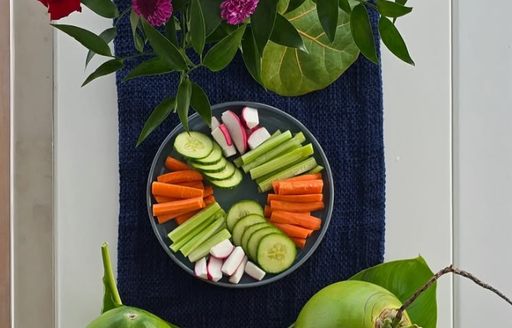 Vegetable arrangement with vibrant flowers