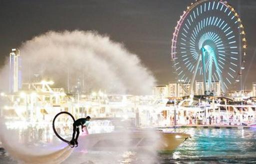 Watersports demonstration at DIBS with light display in background