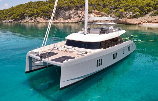 Charter yacht ABOVE & BEYOND at anchor in bay