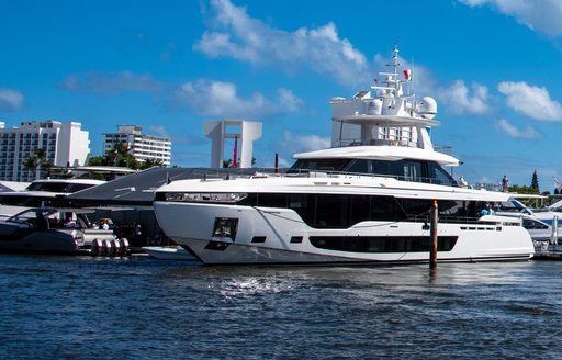 Charter yachts berthed under blue skies at FLIBS