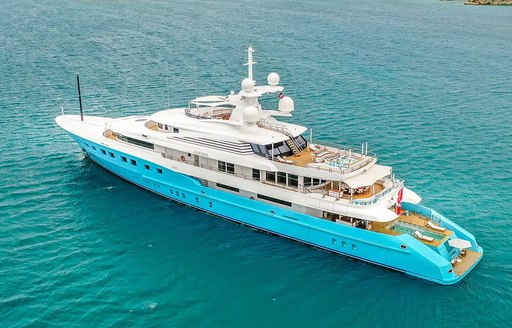 Charter yacht AXIOMA at anchor in a bay