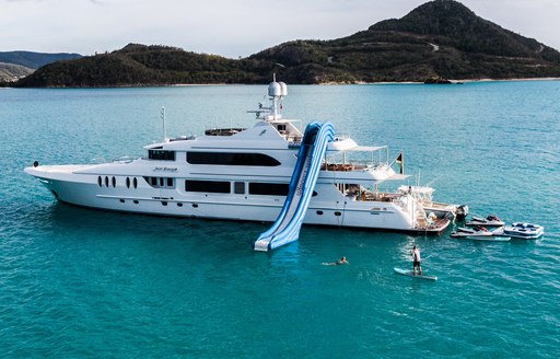 Charter yacht JUST ENOUGH at anchor with waterslide