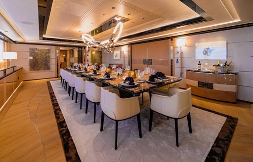 Formal dining setup in the interiors onboard charter yacht PROJECT X