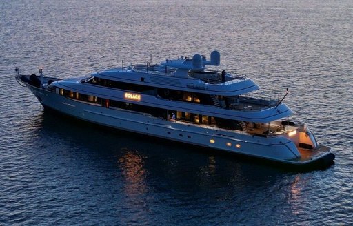 Charter yacht SOLACE at anchor, surrounded by sea at dusk