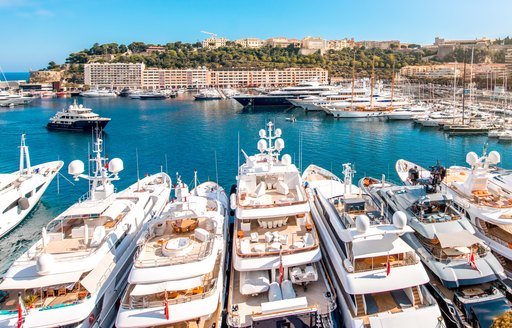 Overview of Port Hercule with many luxury yacht charters berthed