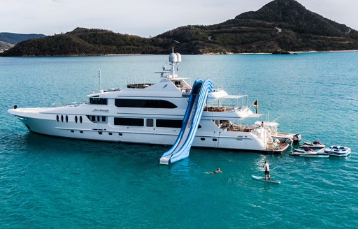 Charter yacht JUST ENOUGH at anchor with waterslide