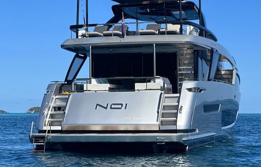 Charter yacht NOI aft deck view at anchor