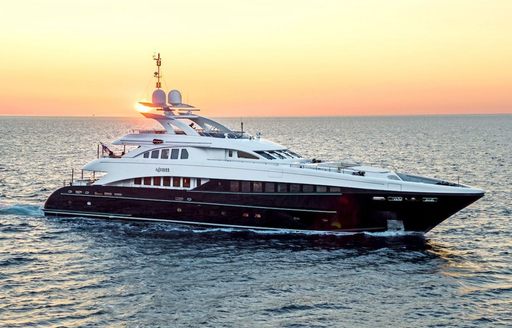 Charter yacht AGRAM surrounded by sea at sunset