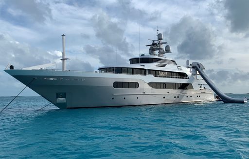 Charter yacht STARSHIP at anchor with water slide