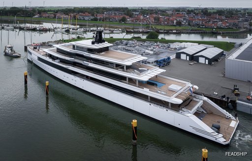 Aerial aft view of superyacht ULYSSES leaving the construction shed at a Feadship facility