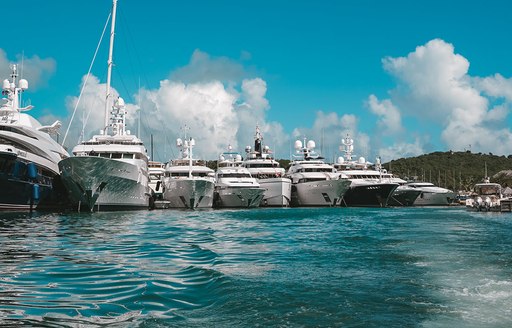 Superyacht charter bows berthed at Antigua Charter Yacht Show