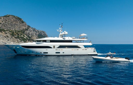 Charter yacht LADY I at anchor with tender