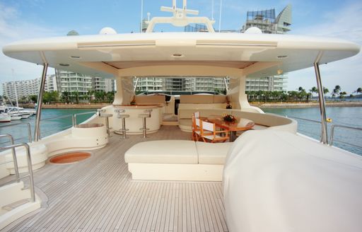 A sundeck of a yacht heading to the skyline of Singapore