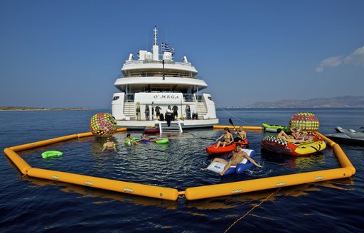 aft view of superyacht O'MEGA with water toys 