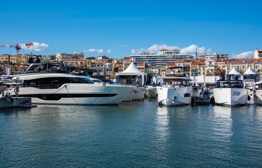 Vieux Port Cannes motor yachts berthed with exhibitor tents