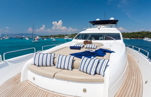 Overview of a sunpad with nautical cushions on the foredeck of charter yacht Winning Streak 2