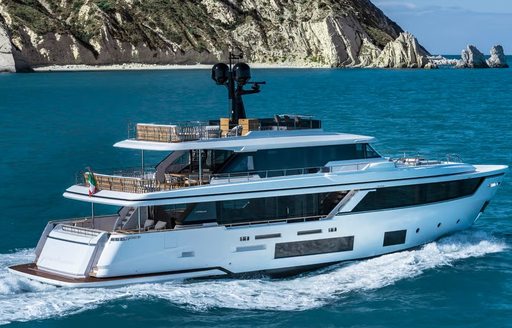 Side view of charter yacht TWINS running