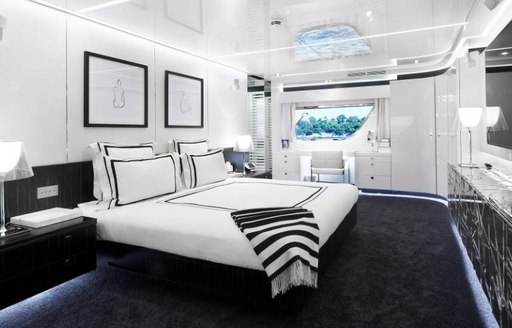 full-beam, monochrome master suite aboard charter yacht JURATA 