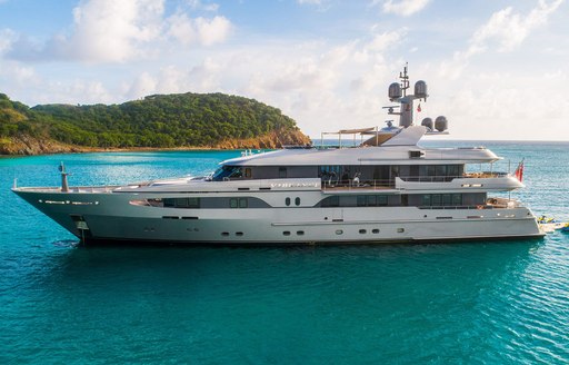 Charter yacht VIBRANCE at anchor surrounded by azure waters