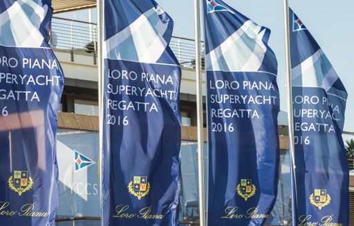 flags wave in the breeze at the LORO PIANA SUPERYACHT REGATTA