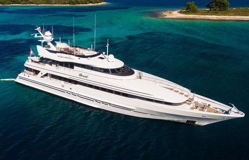 Charter yacht BRAZIL at anchor surrounded by sea 