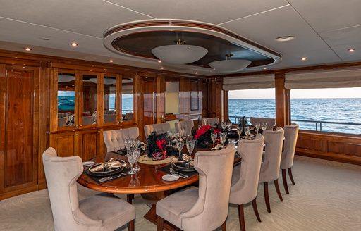 Charter yacht AMORE interior dining room with long table