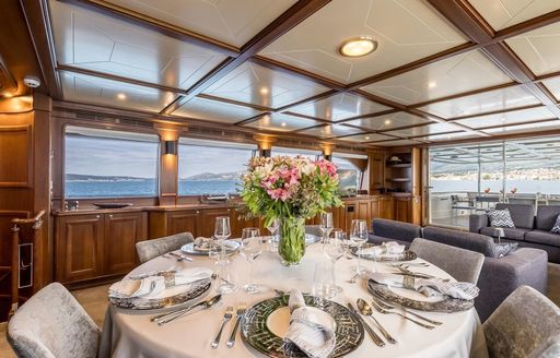 Formal dining area in the main salon onboard charter yacht KLOBUK