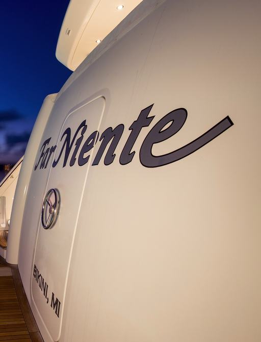 stern of luxury yacht ‘Far Niente’ as sun sets