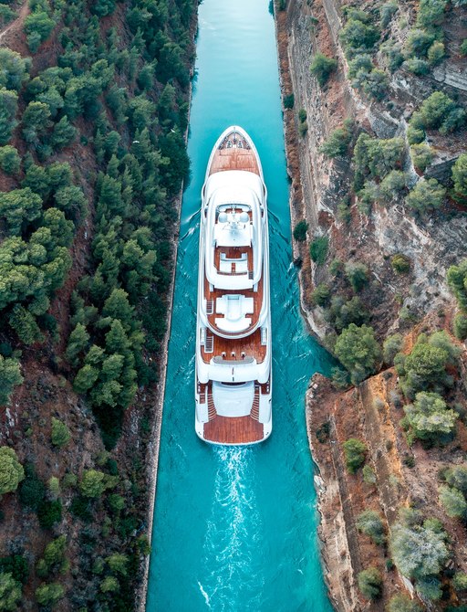 aerial shot of superyacht optasia in corinth canal