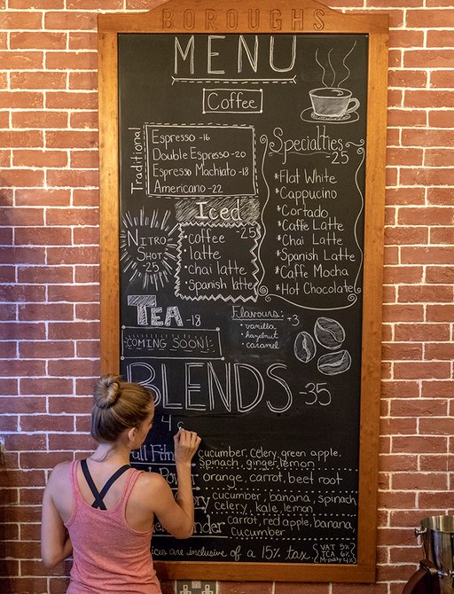 Waitress writing on specials board at Boroughs Yas Marina