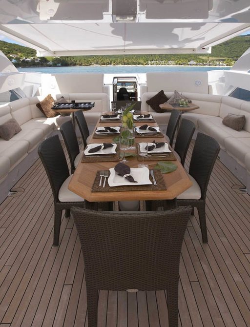 Alfesco dining on sun deck covered by awnings on board superyacht Destiny