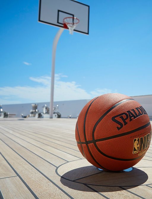 basketball court and net on luxury yacht JOY highlighted by the sun 