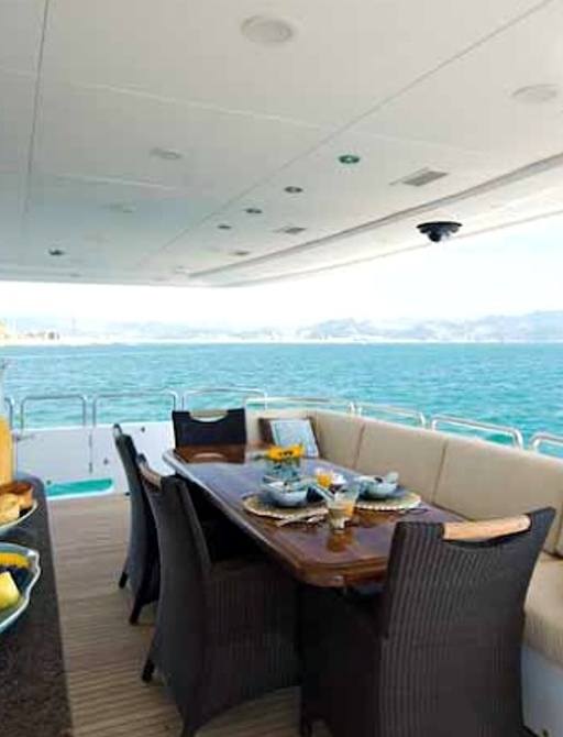 luxury motor yacht VIVA MAS sheltered al fresco dining area 