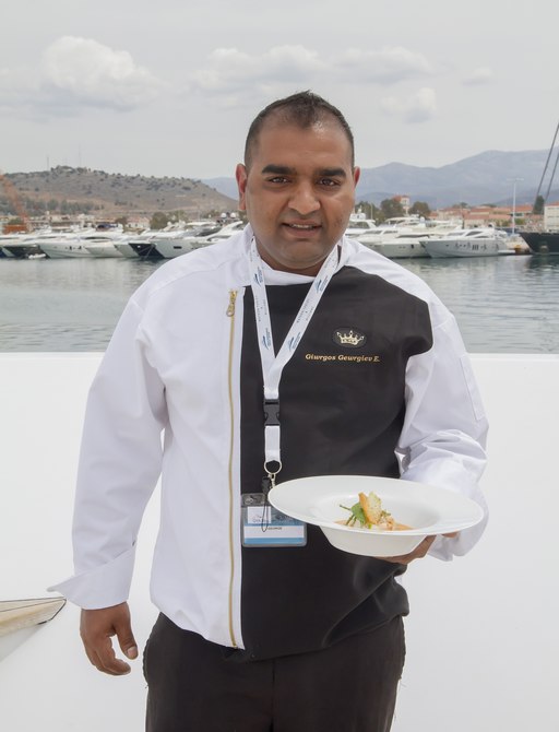 The chef onboard motor yacht AURORA photographed with his competition dish