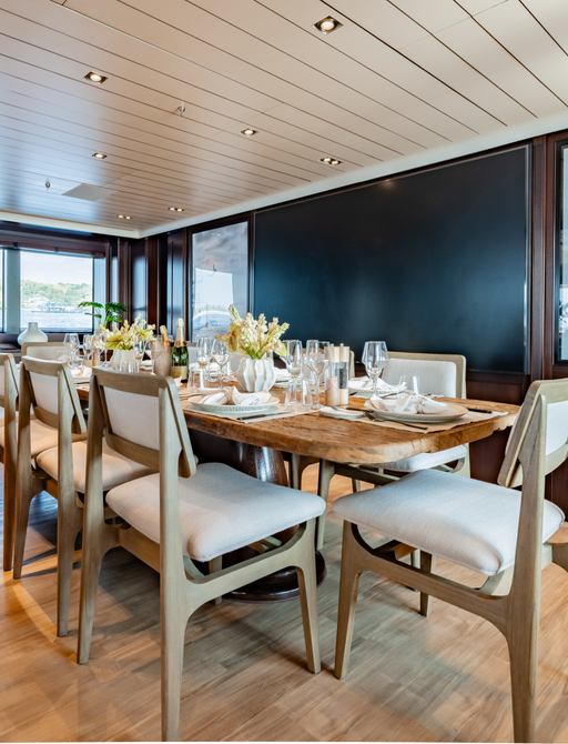 Charter yacht GALILEO interior dining table set for a meal