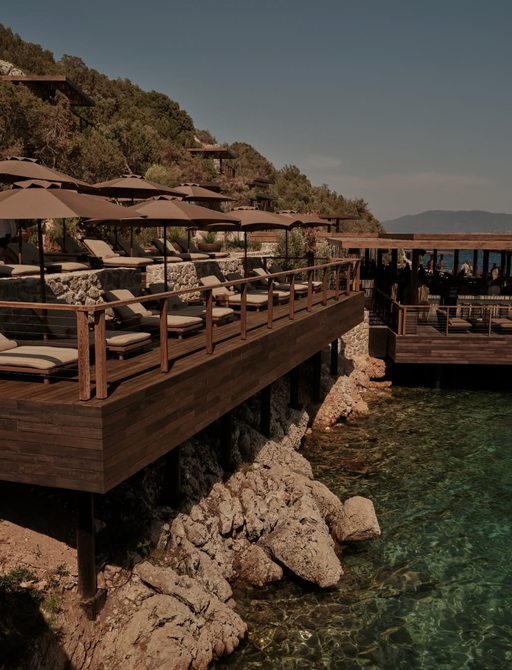 Sun loungers at Scorpios Bodrum with parasols
