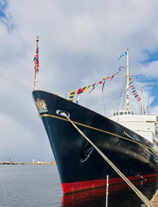 The Royal Yacht Britannia showing the Queens Crest on her bow