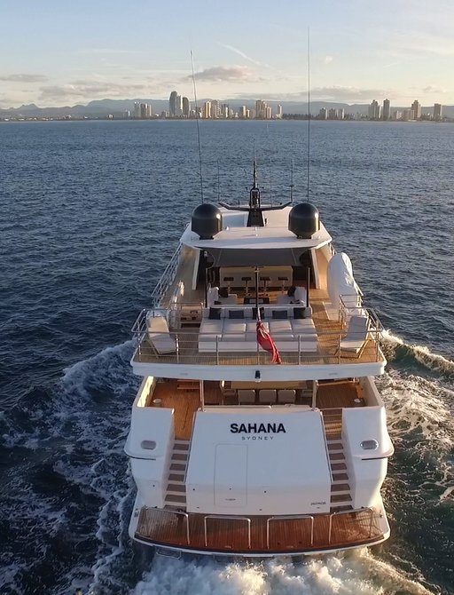 luxury yacht cruises through the waters of Sydney on a charter vacation