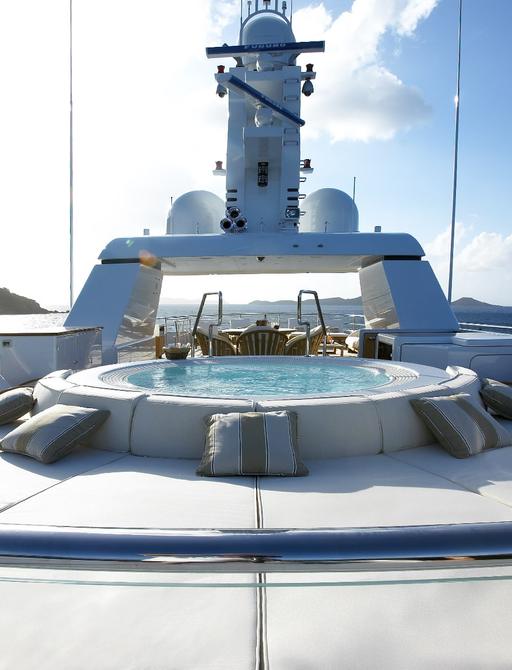 Jacuzzi and sunpads on sundeck of superyacht HARLE 