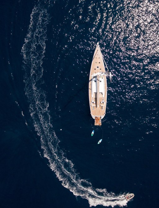 charter yacht gliss aerial shot, with tender at side
