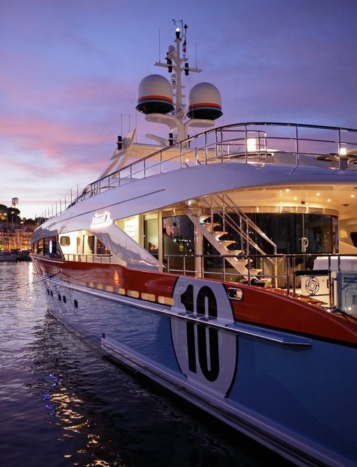 motor yacht AURELIA shows off distinctive hull at sunset