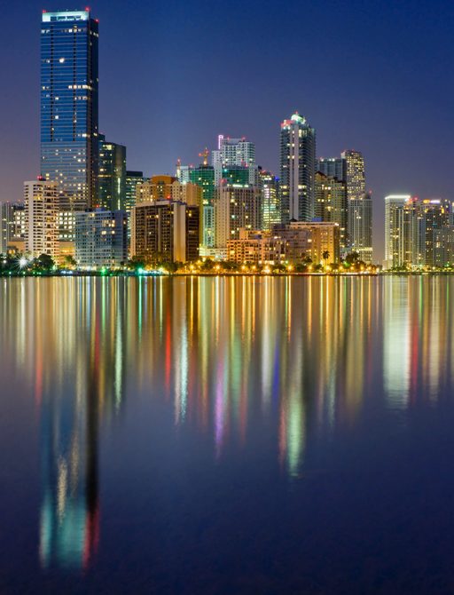 Biscayne Bay at Night reflected in the calm waters of Miami