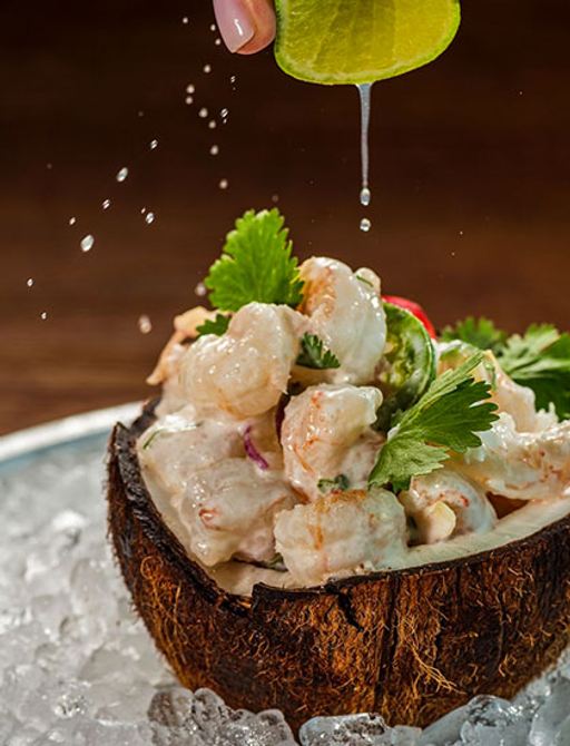 Lime squeezed over prawns at fine dining restaurant in the Maldives