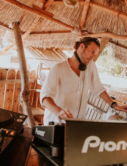 A DJ with headphones at Laganini