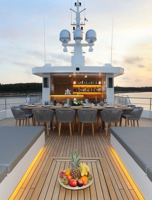 aft deck social area on board superyacht siempre, with dining and lounge area