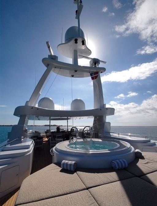 Jacuzzi and dining under the radar arch on sundeck of motor yacht ALLEGRIA