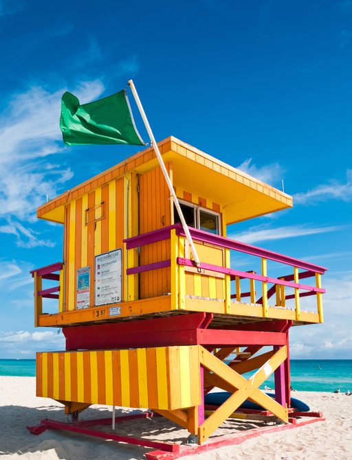 colourful coastguard hut on a white sand Miami beach